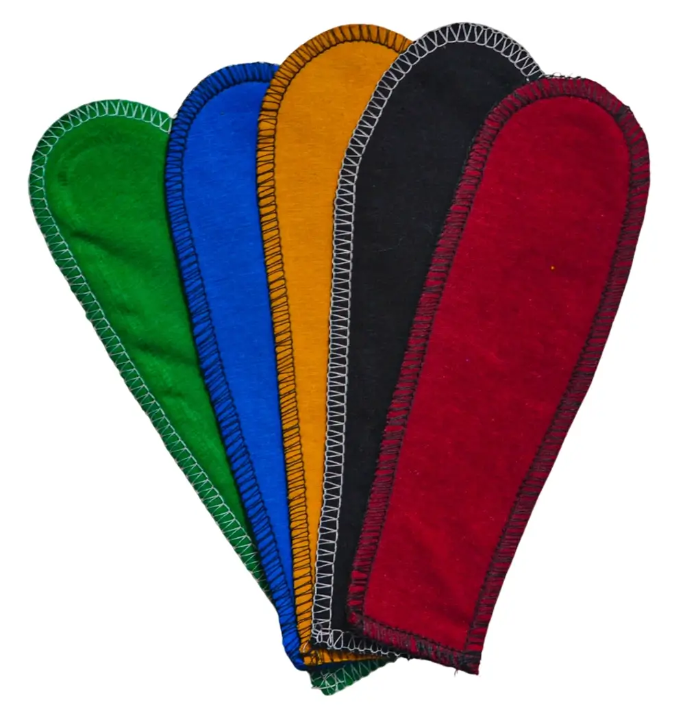A set of five PadMad reusable liners arranged together, shown in five distinct solid colors: green, black, blue, yellow, and red.