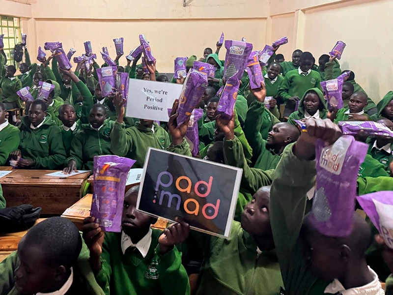 300 Students of St. Peter’s Iten hold eco-friendly menstrual kits after a successful menstrual health and hygiene (MHH) training session, at St. Peter’s Iten. Photo by: PadMad