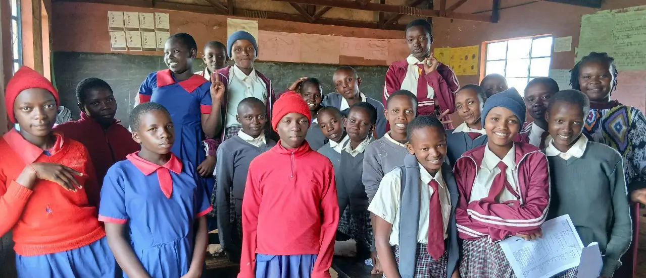 Teacher Jedidah Kavita with some of the students from Oldonyo Oibor and Junior Primary School during the Follow-up outreach. Photo by: PadMad Kenya